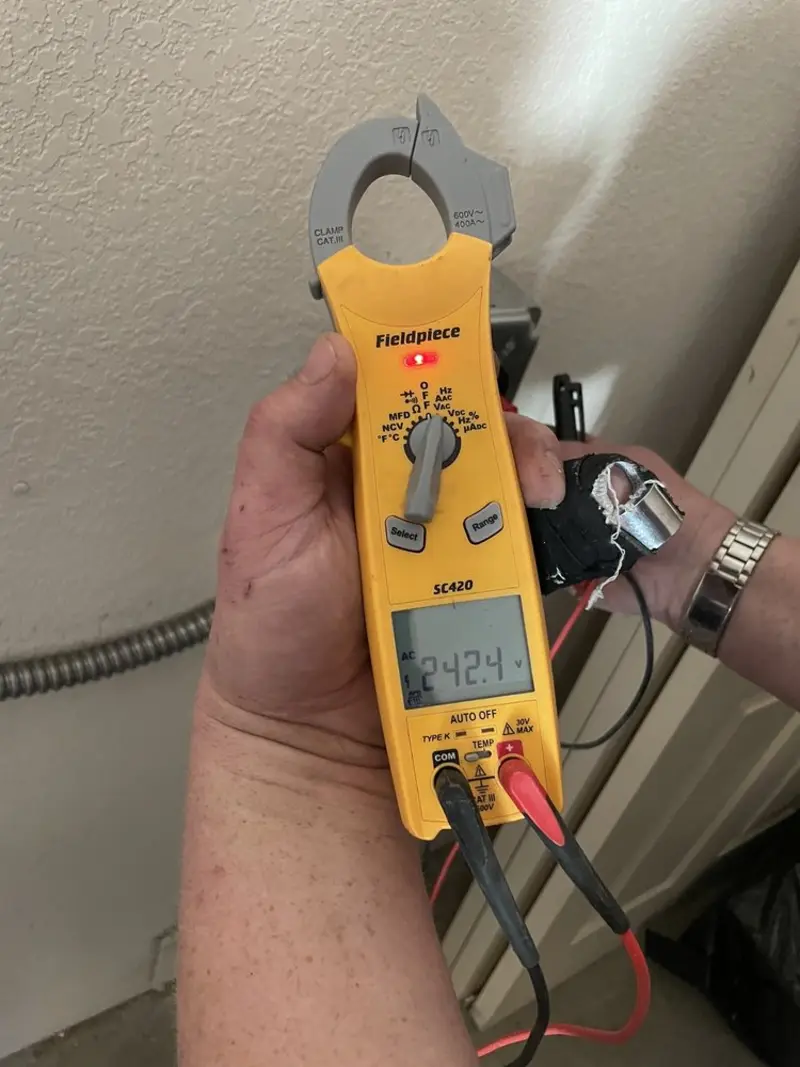 Voltage testing with clamp meter during Generator Installation in Crosspointe